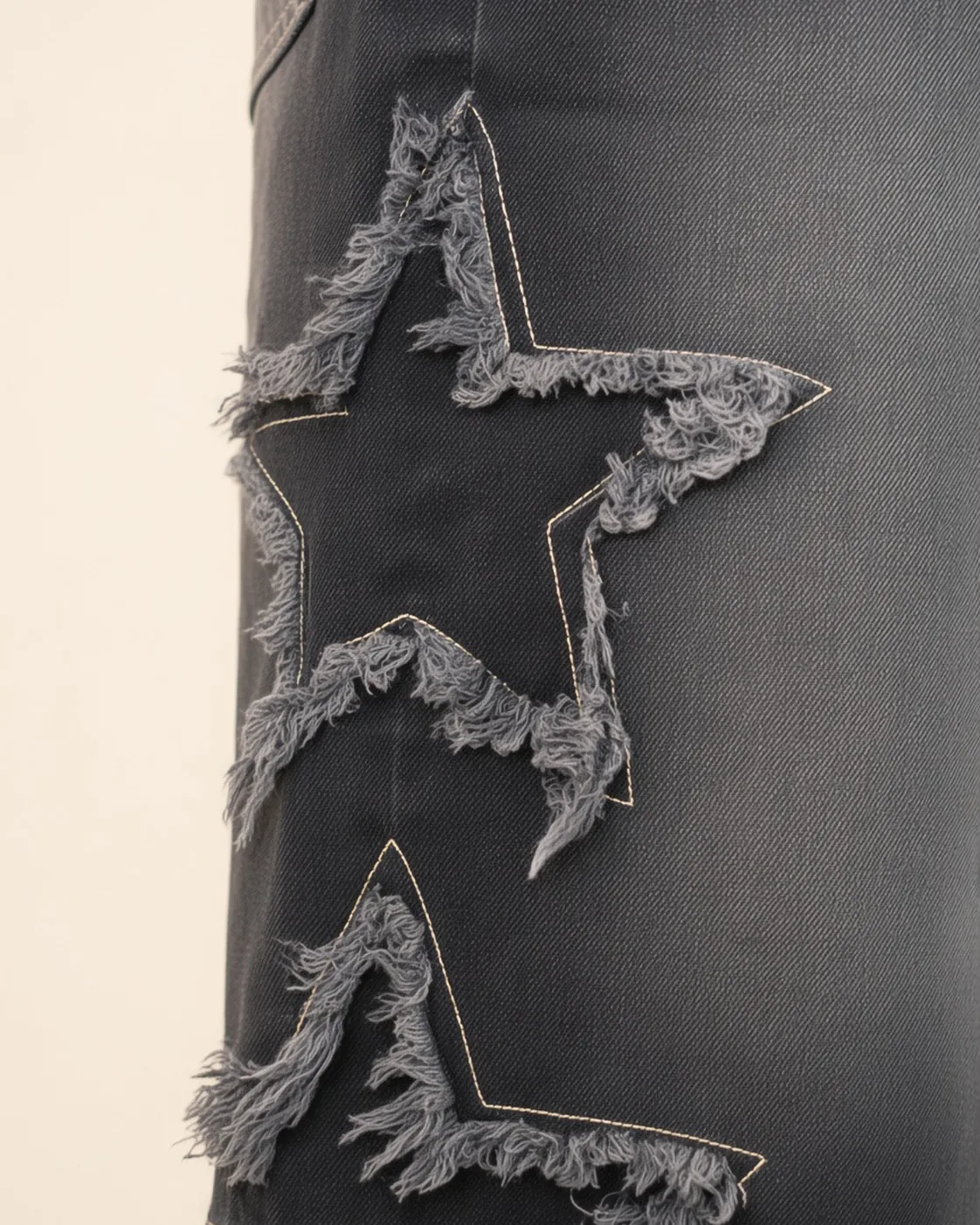 Black graphic denim shorts, construction detail, development reference