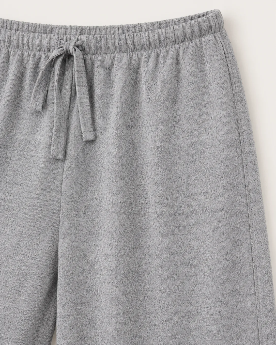 Grey melange knit pants, construction detail, development reference