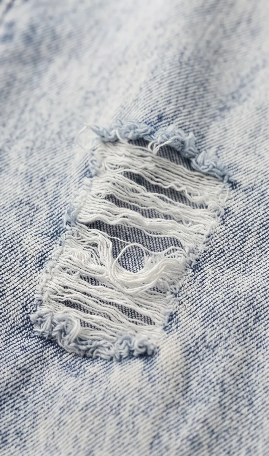 Acid-wash knee-rip jeans, micro view, development reference
